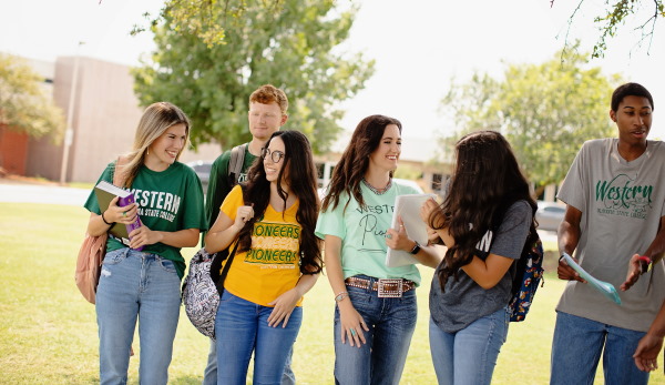 Students walking and talking to each other on Western Oklahoma State College campus.